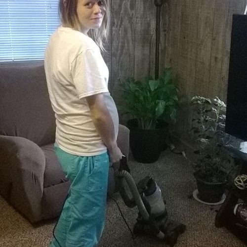 Amanda cleaning a weekly customers house.