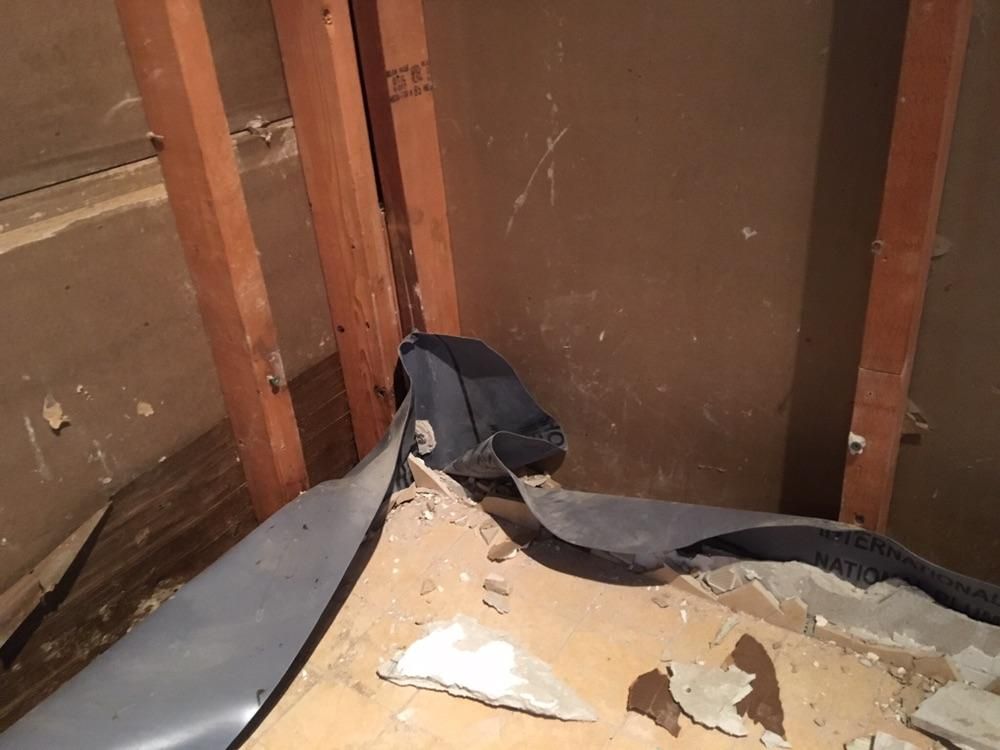 Before photo of incorrect shower pan liner install