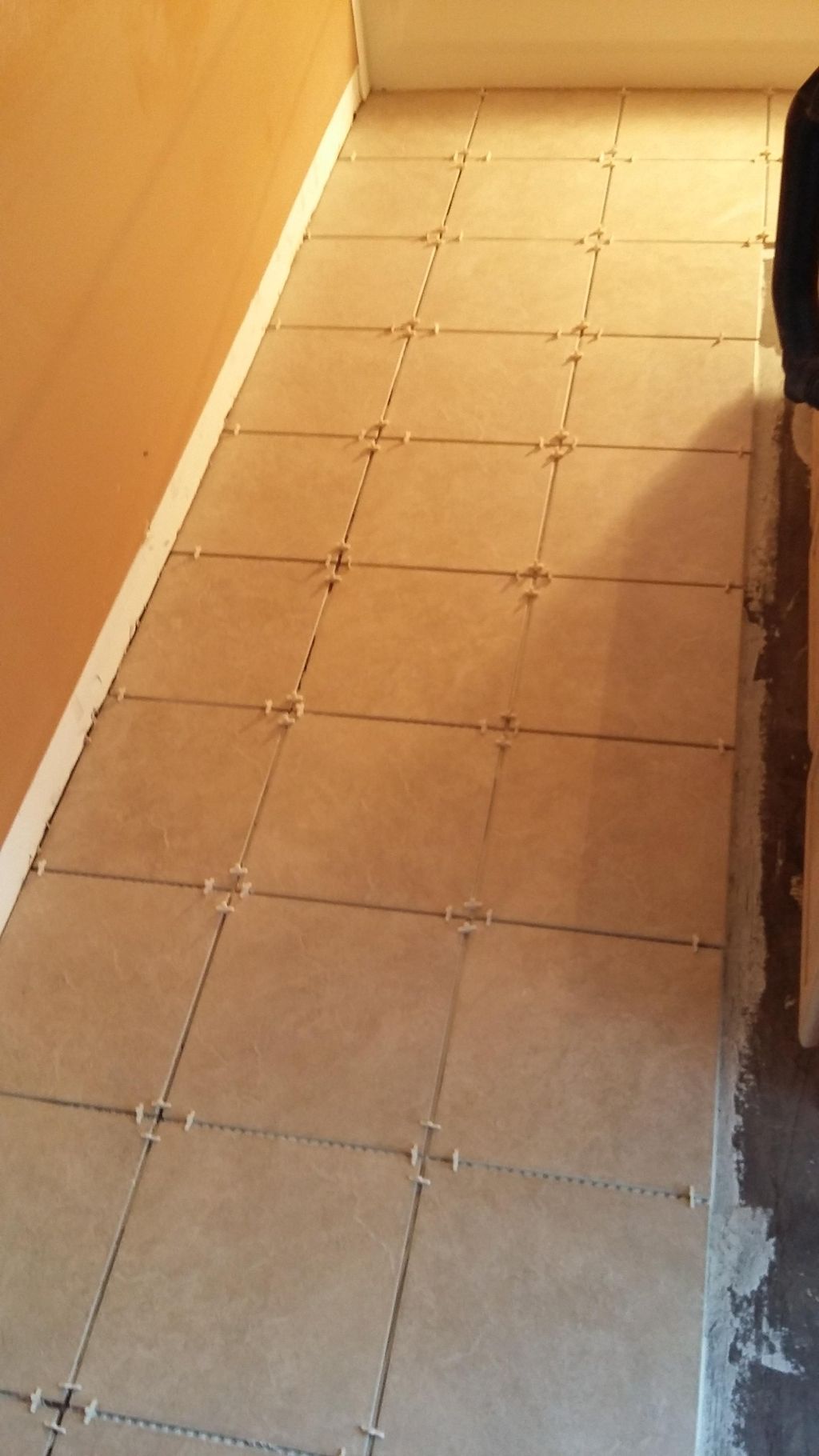 New tile installed in a bathroom remodel job. Note