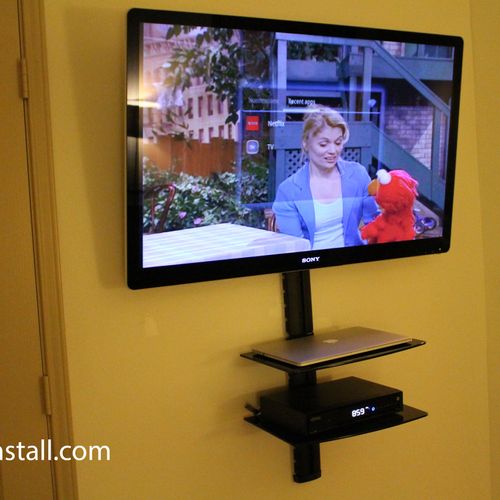 TV mounted with DVD wall unit under