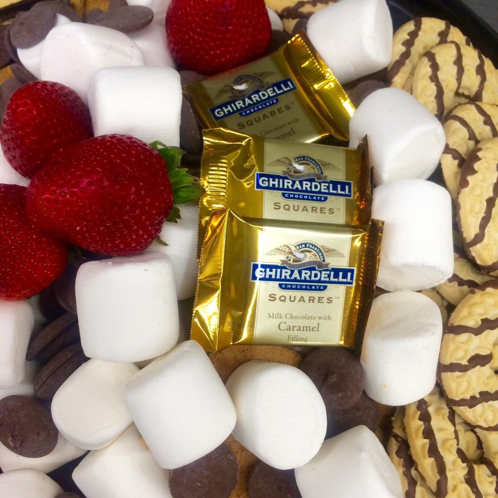 Strawberries marshmallows cookies and chocolates 