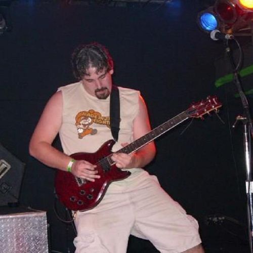 Playing lead guitar for former local alt-rock band