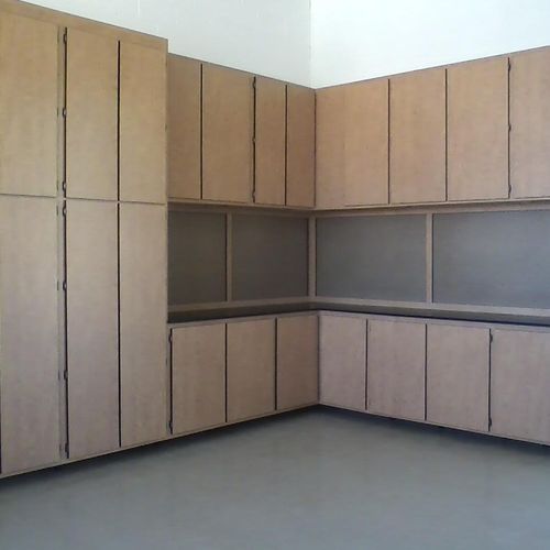 Corner set of cabinets in Sunrise with workbench