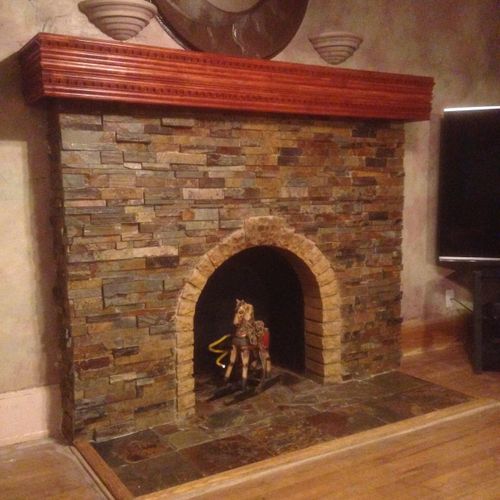 refinished fireplace with stone veneer and custom 