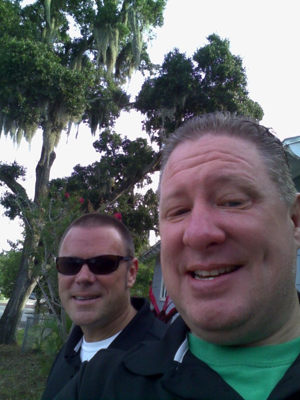 Chris and Evan smiling for the camera after a smal