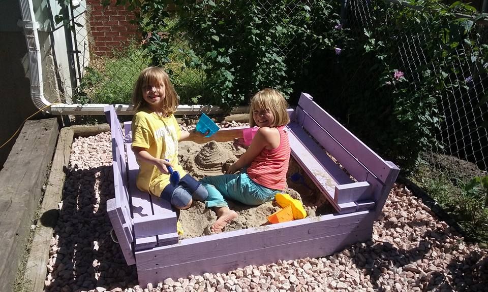 Kids sandbox with folding lid that converts into s