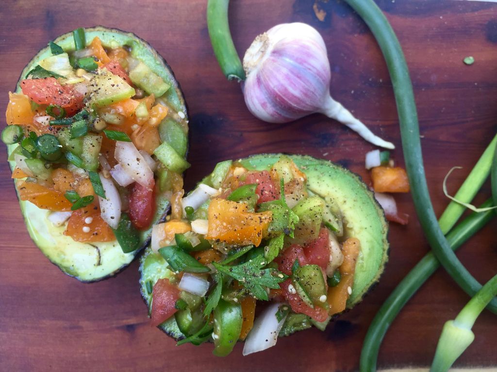 Nutrient avocado boats topped with garden fresh sa