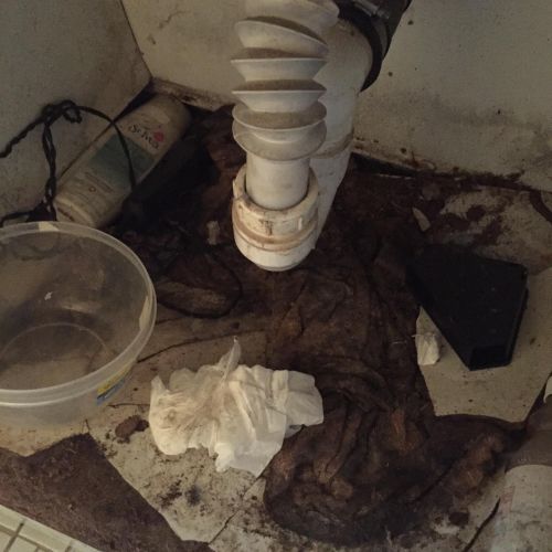 Bathroom pipe burst over a year before this pictur