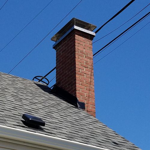 chimney tuck-pointing and custom rain cover.
