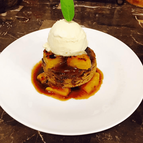 warm sticky toffee cake with hot buttered rum sauc
