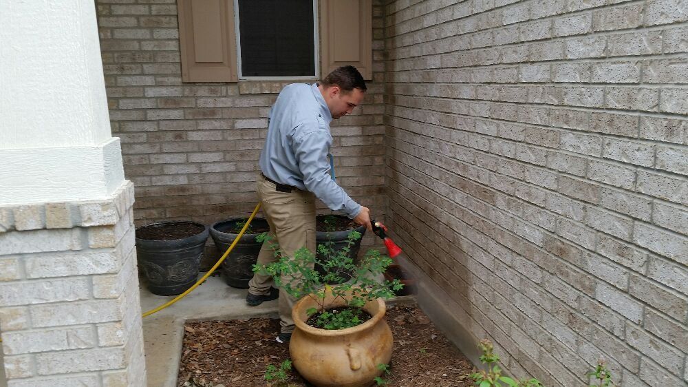 Tyson doing an outside foundation spray for one of