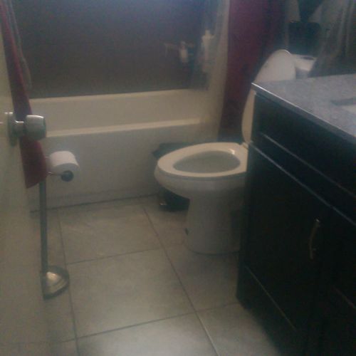 new toilet, tiled floor