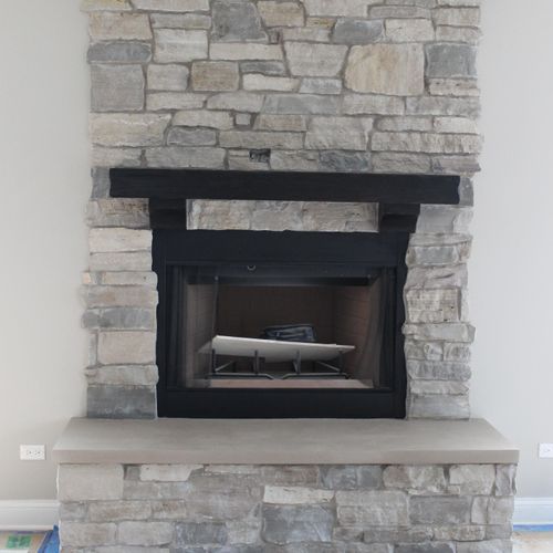 Stone veneer fireplace