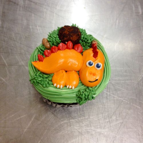 Dino cupcake.Decorated with Swiss buttercream