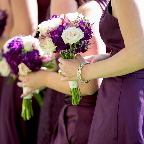 Bridesmaid bouquets in purple and plum hues