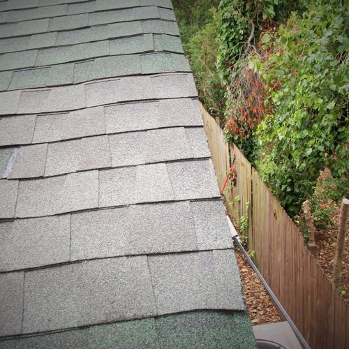 AFTER: I replaced shingles on edge of damaged roof