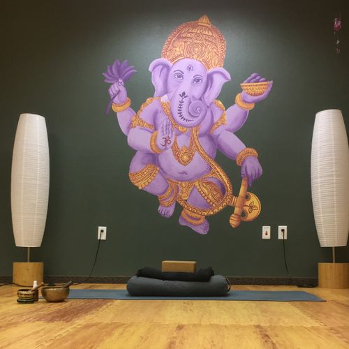 Yoga space with padded flooring, props & mats avai