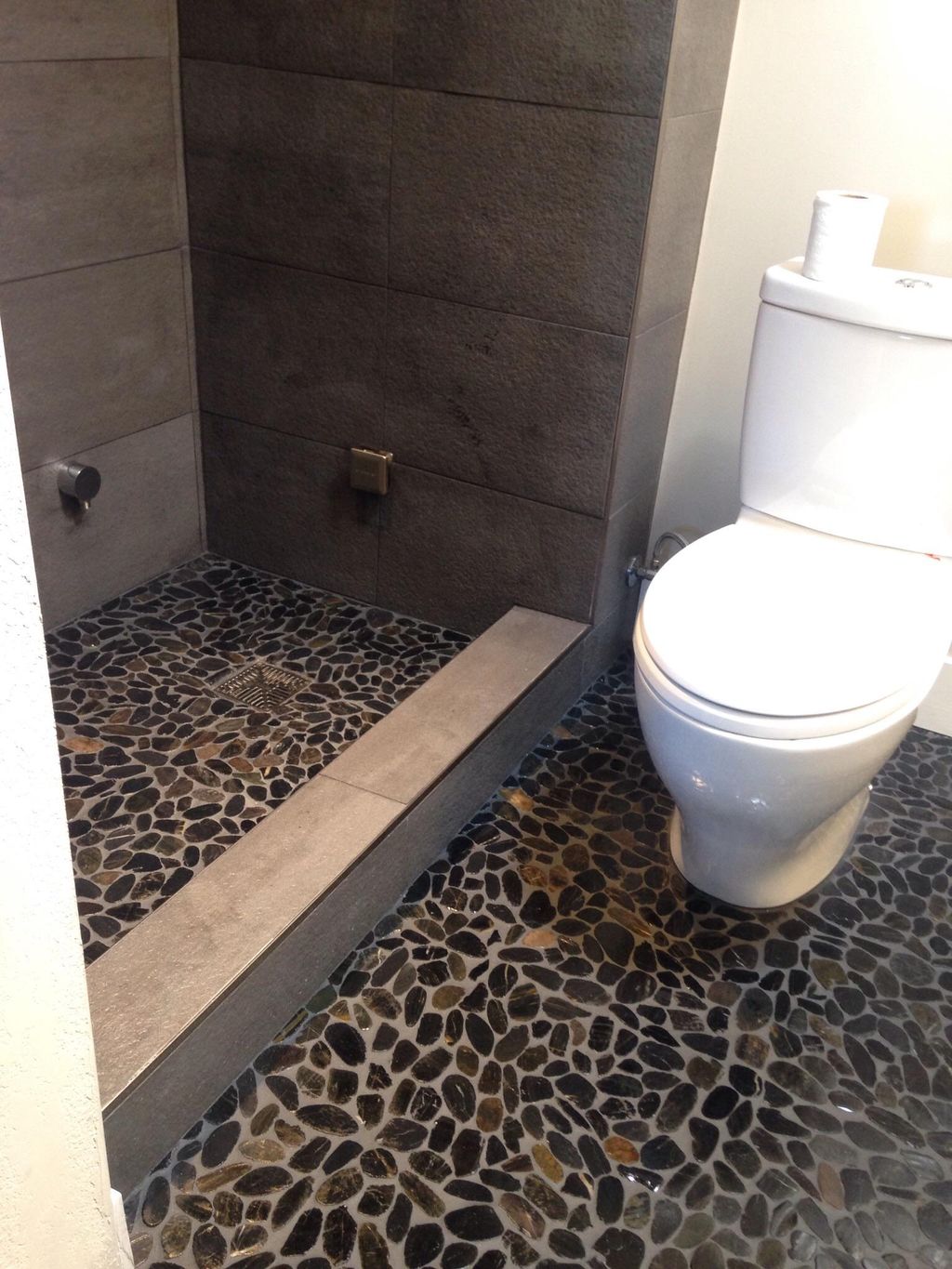 Custom steam shower with River Rock floor in showe