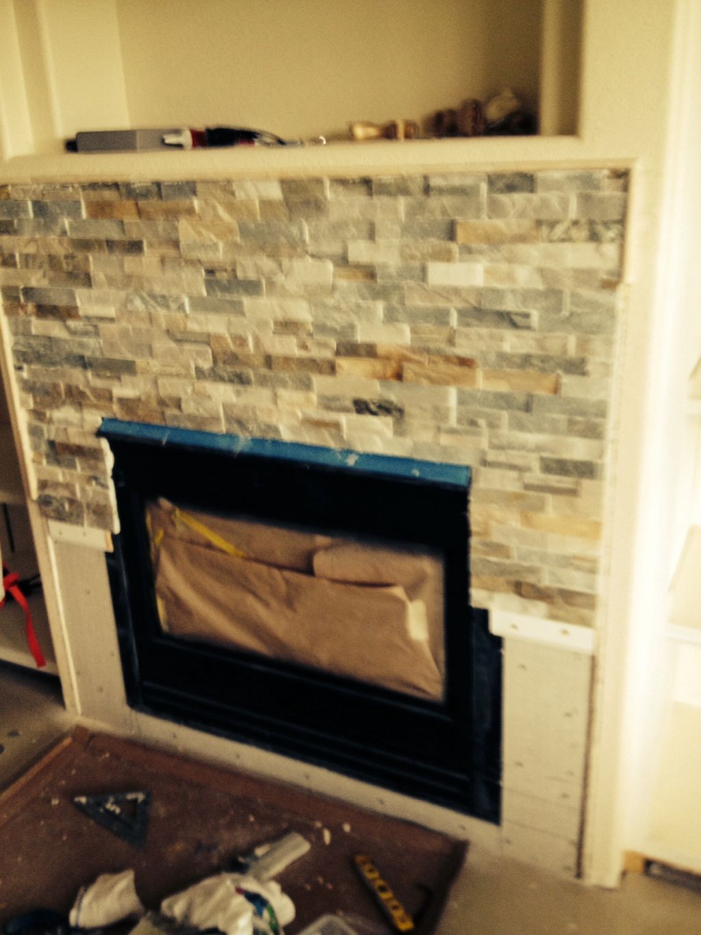Installed the stone around fireplace