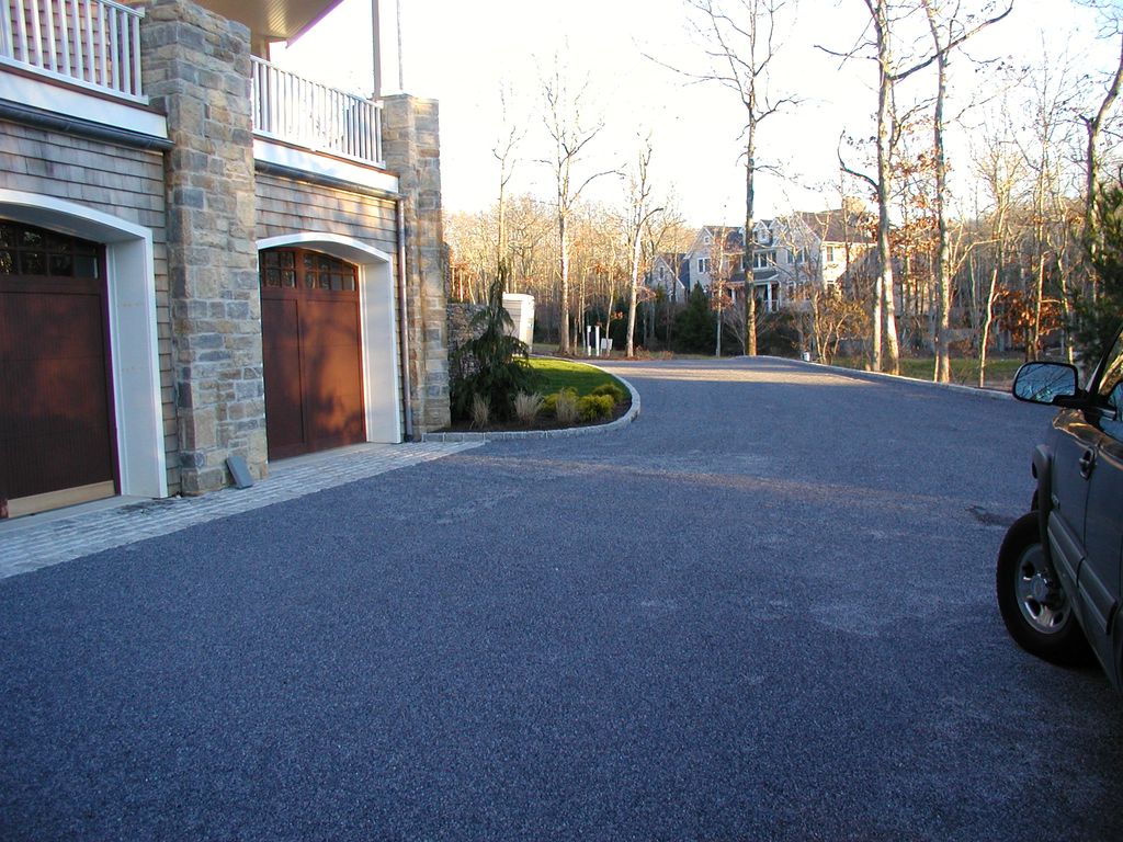 Oil & stone driveway with belgium block edging.