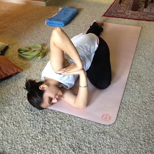 A client in Pigeon Pose twist.