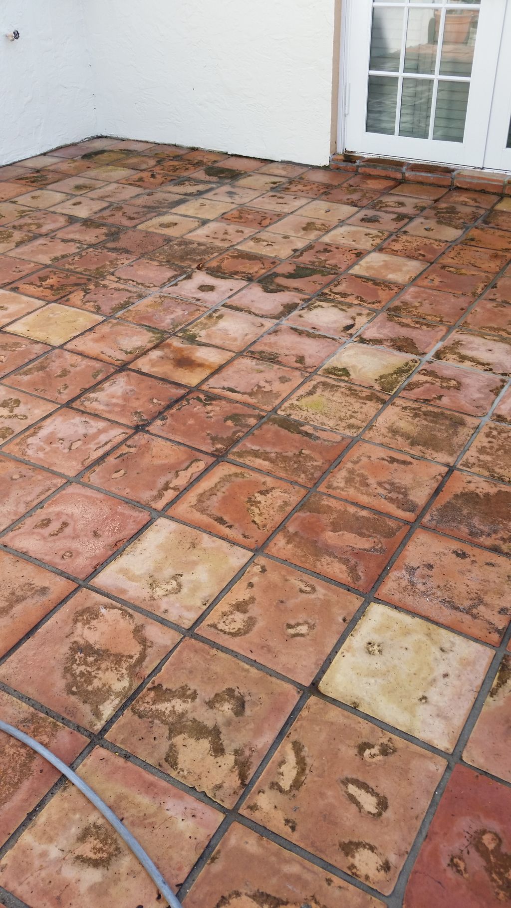 Spanish tile patio before we treated and pressure 
