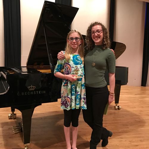 My piano student, Lucy, having just WON her level 