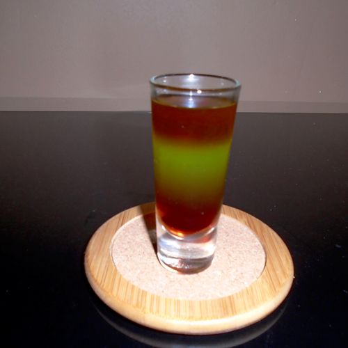 Layered shot combining three different liqueurs, w