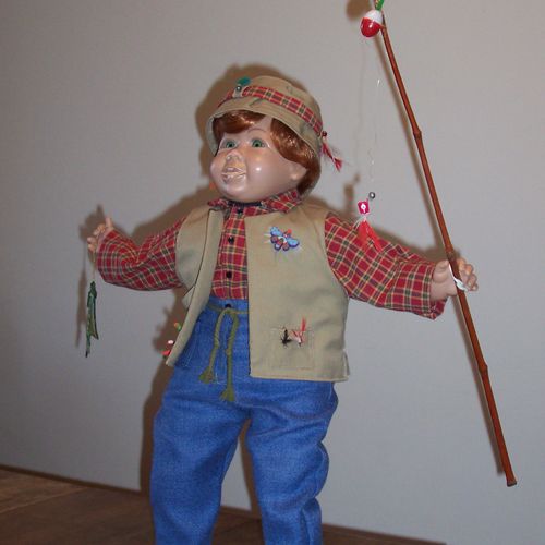 "Gone Fishing"  this is a large vinyl doll, design