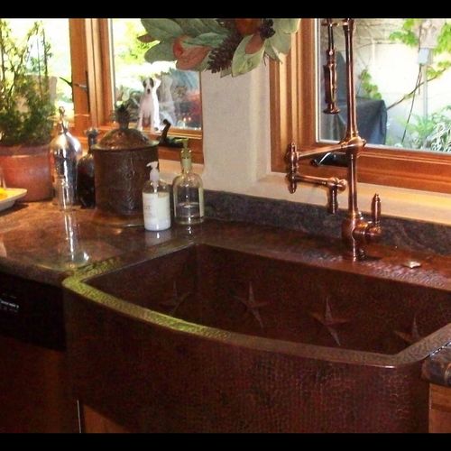 Hand forged patina copper farm sink.