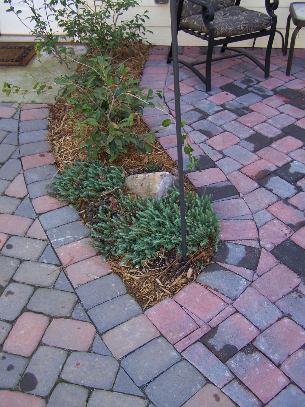 Paver walkways with built in border garden for con