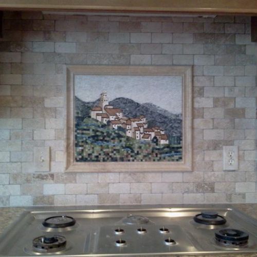 oven backsplash with a picture inlay.