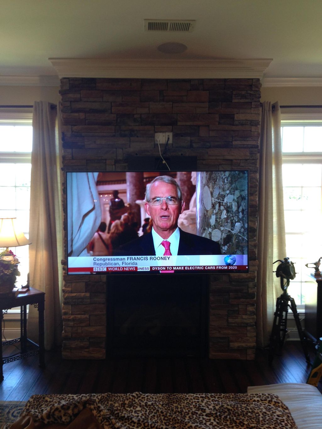A custom mount "Lowered" over the fireplace.  The 