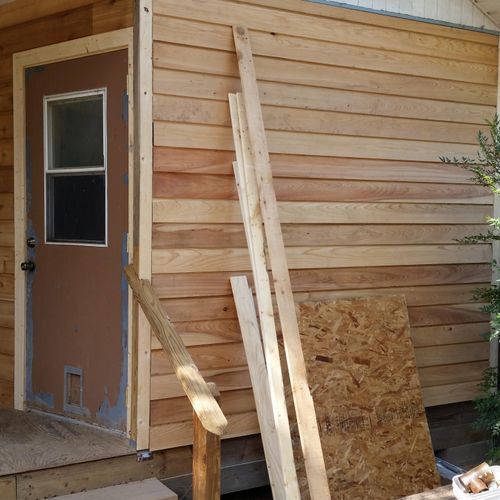 closed in the right side of the porch with cedar p