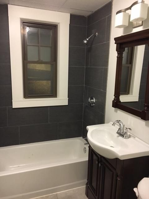 A remodeled bathroom provided by our maintenance t