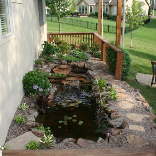 This small pond is build with sand stone moss rock