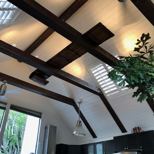 Installed shiplap ceiling and decorative beam
