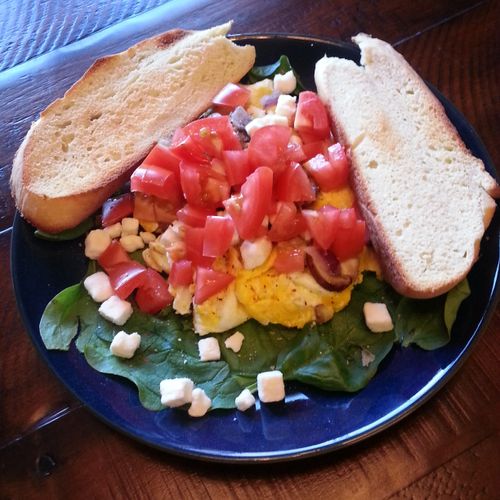 Egg on Wilted Spinach with Tomato and Feta