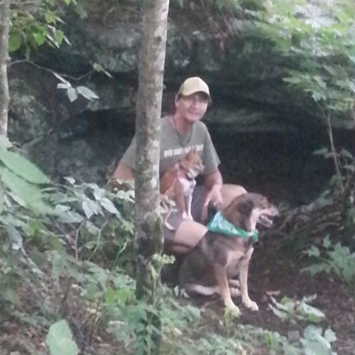 Bandit and Erik hiking in the woods.