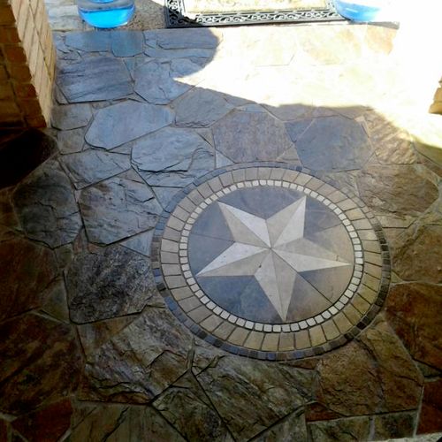 Front entrance done in slate with a marble star