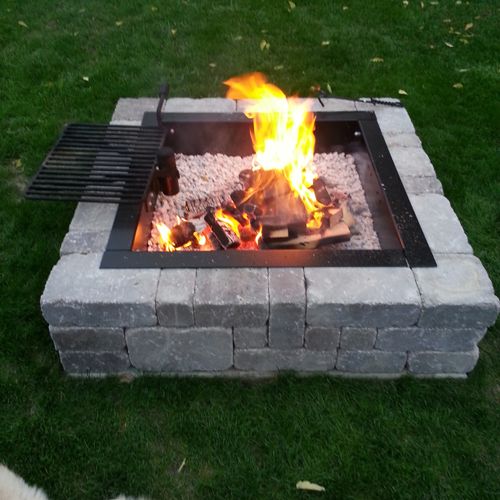 A fire pit I put in my backyard with a grate we co