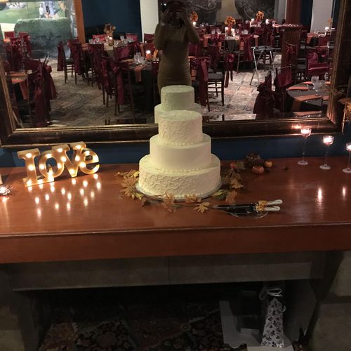 Fall themed wedding reception cake table.