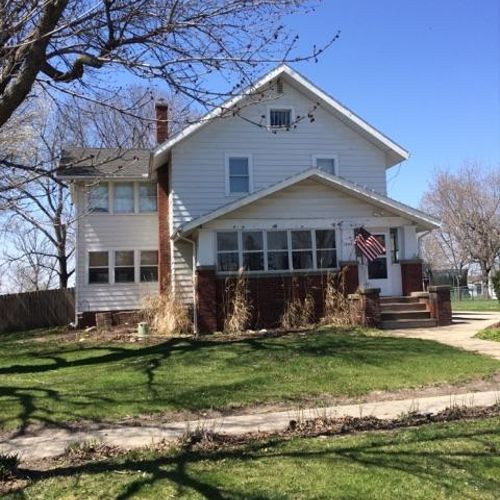 Before photo of a house painted in Granger, IA.