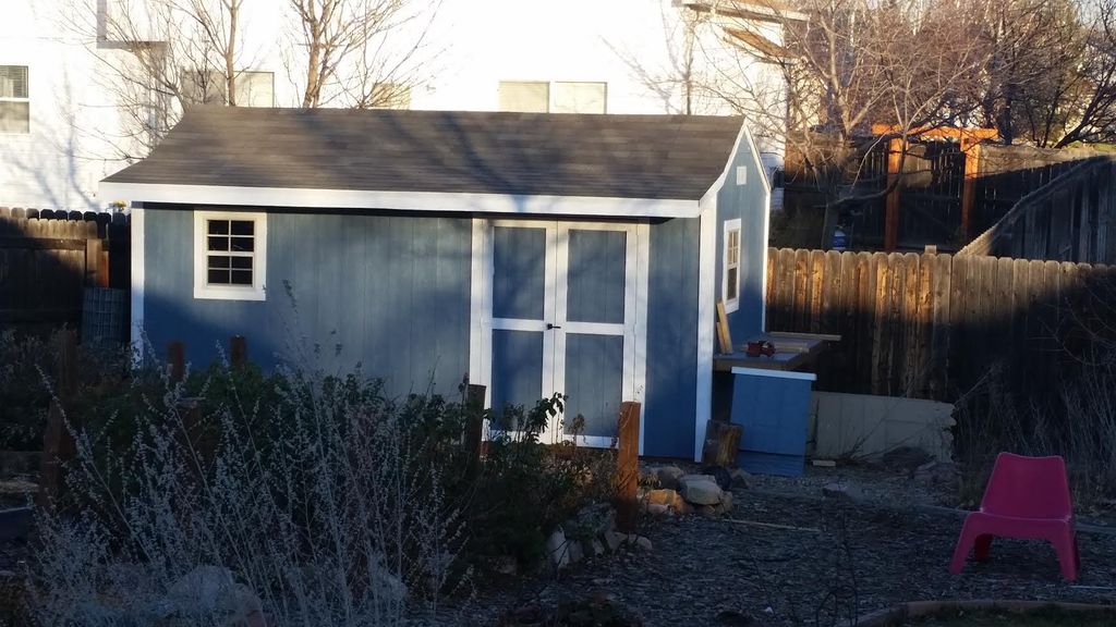 8 x 16 shed with overhang, workbench, and small po