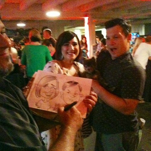 Speed Sketchers strolling around a party and drawi