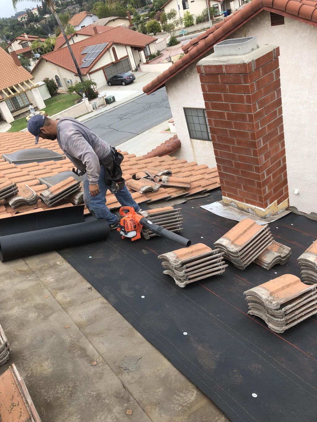 Budget friendly roof recover. Re use tile and save