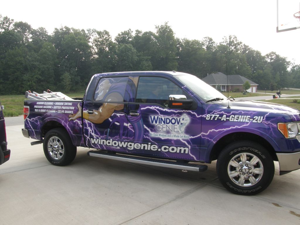 Our employees drive wrapped Window Genie trucks fo