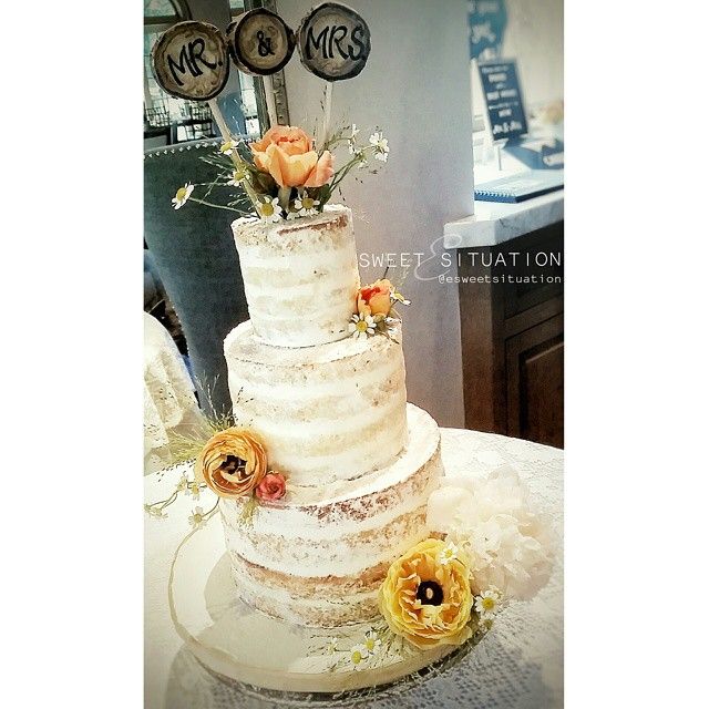 rustic naked cake with fresh flowers