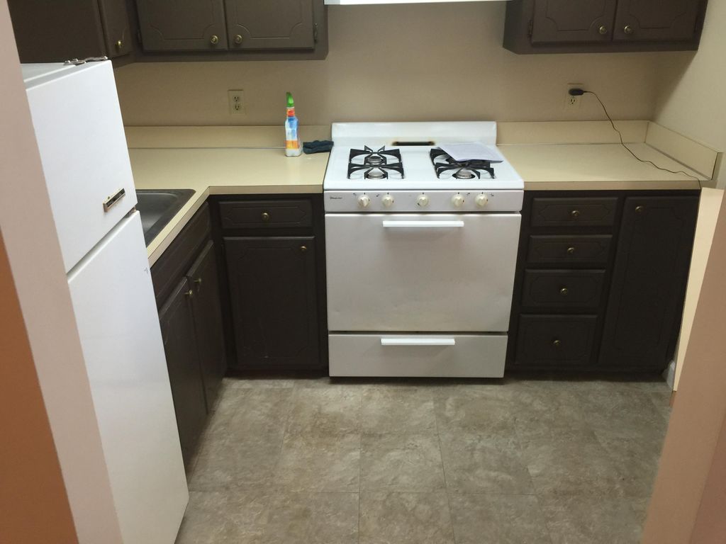 Refinsihed wood cabinets from a stained wood to th