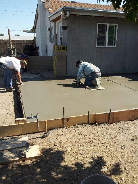 Pouring concrete for an exterior patio.